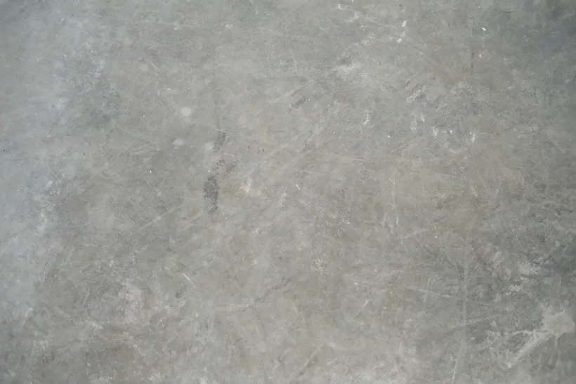 Cracked, stained concrete studio floor before epoxy coating in Ryde