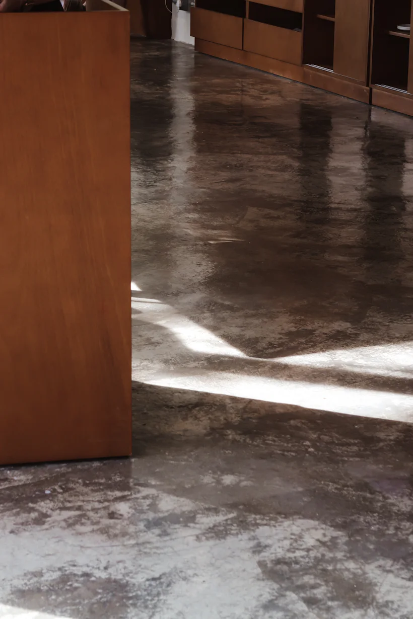 Cracked, stained concrete garage floor before epoxy coating in Bella Vista